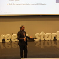 Kyle Lai presenting at 2025 CMMC Midwest Conference