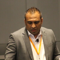 Prabhat Nigam presenting at a conference